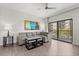 Inviting living room with a large gray sectional sofa and access to outdoor balcony at 14501 Grove Resort Ave # 3335, Winter Garden, FL 34787