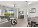 Comfortable living space featuring modern furnishings, balcony access and an open floorplan at 14501 Grove Resort Ave # 3335, Winter Garden, FL 34787