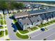 Wonderful aerial view of newly constructed townhomes, screened-in patios, and manicured landscaping at 1624 Tropical Palms Cir, Kissimmee, FL 34747