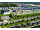 Gorgeous aerial view of newly constructed townhomes with ample parking and lush landscaping at 1624 Tropical Palms Cir, Kissimmee, FL 34747
