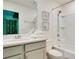 Bright bathroom with a shower-tub combo and vanity at 1624 Tropical Palms Cir, Kissimmee, FL 34747