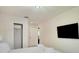 Bedroom with a large bed and a wall-mounted television at 1624 Tropical Palms Cir, Kissimmee, FL 34747
