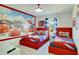 A bedroom with two twin beds and themed wall decorations at 1624 Tropical Palms Cir, Kissimmee, FL 34747