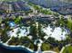 Aerial view of the community's lavish clubhouse and recreational amenities, including water park and pools at 1624 Tropical Palms Cir, Kissimmee, FL 34747
