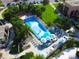 Aerial view of FlowRider with people enjoying the water feature at the community's recreational area at 1624 Tropical Palms Cir, Kissimmee, FL 34747