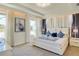 Luxurious main bedroom with tray ceilings, ambient lighting, plush carpet, and elegant decor for a relaxing retreat at 1624 Tropical Palms Cir, Kissimmee, FL 34747