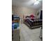 Bedroom with a stylish accent wall and fish tank at 1639 Nestlewood Trl, Orlando, FL 32837