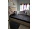 Bedroom with a tufted headboard and neutral decor at 1639 Nestlewood Trl, Orlando, FL 32837