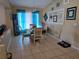 Light-filled dining room with a glass table, stylish chairs, and decorative wall art at 1639 Nestlewood Trl, Orlando, FL 32837