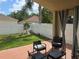Inviting outdoor patio with brick flooring, comfortable seating, and a view of the fenced backyard at 1639 Nestlewood Trl, Orlando, FL 32837