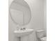 Powder room features white pedestal sink and toilet at 1830 Juneberry St, Clermont, FL 34715