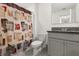 Bathroom featuring toilet, sink, shower and patterned shower curtain at 1830 Juneberry St, Clermont, FL 34715