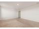 A bright bedroom features neutral carpet and fresh paint at 1830 Juneberry St, Clermont, FL 34715