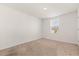 Bedroom with neutral carpet, a window and fresh paint at 1830 Juneberry St, Clermont, FL 34715