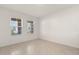 Bright, neutral bedroom features tiled floor and double windows at 1830 Juneberry St, Clermont, FL 34715