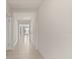 Bright hallway featuring tile flooring and white walls at 1830 Juneberry St, Clermont, FL 34715