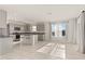 Open kitchen boasts stainless appliances, granite countertops, and a breakfast bar at 1830 Juneberry St, Clermont, FL 34715