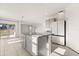 Bright kitchen features a center island with granite countertop and tile floors at 1830 Juneberry St, Clermont, FL 34715