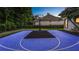 Full-sized basketball court in the backyard of the house with modern design at 1906 Oakbrook Dr, Longwood, FL 32779