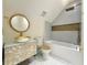 Stylish bathroom featuring gold fixtures, a unique sink and vanity, and tile accents at 1906 Oakbrook Dr, Longwood, FL 32779