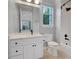 Clean bathroom with a white vanity, a shower-tub combination, and a large mirror at 1906 Oakbrook Dr, Longwood, FL 32779