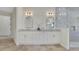 Elegant bathroom with double vanity, granite countertop and frameless glass shower at 1906 Oakbrook Dr, Longwood, FL 32779