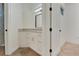 View into a bathroom with a white vanity and decorative mirror at 1906 Oakbrook Dr, Longwood, FL 32779