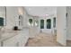Modern bathroom with double vanity, sleek fixtures, soaking tub and a frameless glass shower at 1906 Oakbrook Dr, Longwood, FL 32779