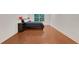 Minimalist bedroom with hardwood floors, natural light, and neutral walls at 1906 Oakbrook Dr, Longwood, FL 32779