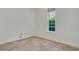 Simple bedroom with travertine flooring and a window offering natural light at 1906 Oakbrook Dr, Longwood, FL 32779