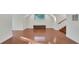 Bonus room with hardwood floors, white trim, and a staircase to the right at 1906 Oakbrook Dr, Longwood, FL 32779