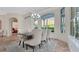 Bright dining room featuring large windows and comfortable seating for six guests at 1906 Oakbrook Dr, Longwood, FL 32779