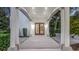 Front entrance of a home with covered access and a decorative front door at 1906 Oakbrook Dr, Longwood, FL 32779