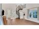 Spacious interior featuring a spiral staircase, wood floors, and an open floor plan at 1906 Oakbrook Dr, Longwood, FL 32779