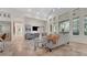 Living room with high ceilings, large windows, stone floors and comfortable seating at 1906 Oakbrook Dr, Longwood, FL 32779