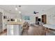 Bright living space featuring a modern kitchen with island seating, and a combined dining and living area at 1906 Oakbrook Dr, Longwood, FL 32779