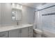 Updated bathroom with modern vanity and tiled shower/tub combination at 1912 Wyandotte Trl, Casselberry, FL 32707