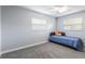 Bedroom features a comfortable twin bed and neutral carpet flooring at 1912 Wyandotte Trl, Casselberry, FL 32707