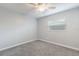 Clean bedroom with neutral walls, carpet, and a ceiling fan at 1912 Wyandotte Trl, Casselberry, FL 32707
