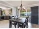 The dining area features modern chandelier, wood floors, and is conveniently located near the kitchen at 1912 Wyandotte Trl, Casselberry, FL 32707
