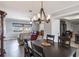 The dining area features modern chandelier, wood floors, and is conveniently located near the living room at 1912 Wyandotte Trl, Casselberry, FL 32707
