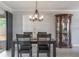 The dining area features modern chandelier, wood floors, and is conveniently located near front entry at 1912 Wyandotte Trl, Casselberry, FL 32707
