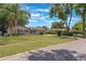 A charming home boasting a well-kept lawn and landscaping, complemented by a serene residential street at 1912 Wyandotte Trl, Casselberry, FL 32707
