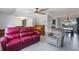 Cozy living room filled with natural light, showcasing a piano, and comfortable seating arrangement at 1912 Wyandotte Trl, Casselberry, FL 32707