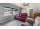 Bright living room with large window, comfortable seating, and elegant flooring creating a welcoming ambiance at 1912 Wyandotte Trl, Casselberry, FL 32707