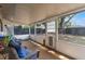 Enclosed back patio with wicker chairs offers an ideal space for entertaining at 1912 Wyandotte Trl, Casselberry, FL 32707
