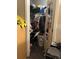 View of a packed closet with clothes, containers, and other household items on shelves and the floor at 20 Water Trak, Ocala, FL 34472