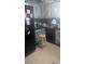 A kitchen boasts painted cabinets, modern appliances, and a functional layout with a stool nearby at 20 Water Trak, Ocala, FL 34472