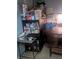 View of a small living room with a hutch with pantry goods, dining table, and basic decor at 20 Water Trak, Ocala, FL 34472