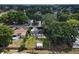 Aerial view of the property showing the backyard, shed, and surrounding neighborhood from above at 207 Rose St, Auburndale, FL 33823